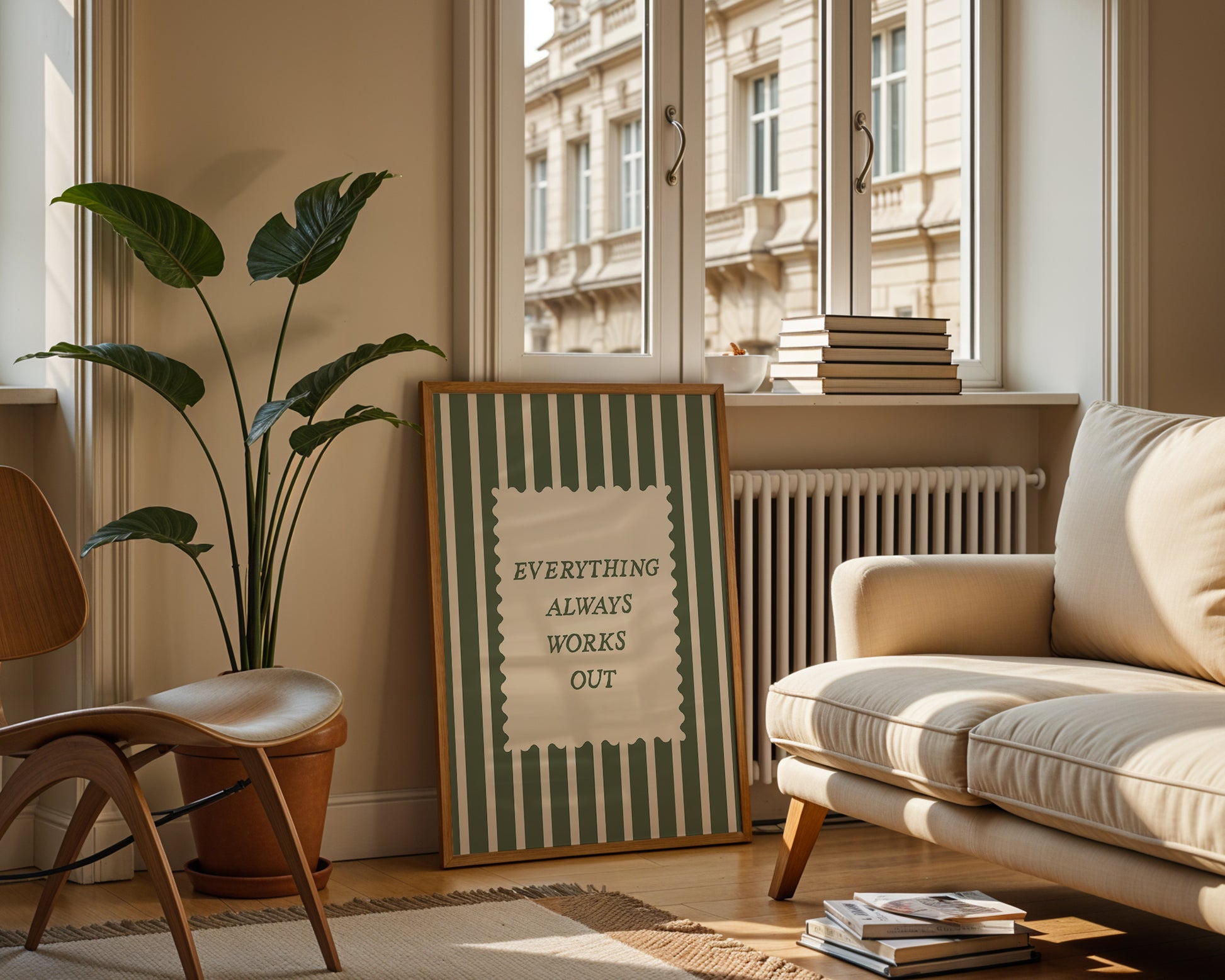 Vertical wall print with bold forest green vertical stripes and a cream scalloped text box reading Everything Always Works Out in dark green serif typography