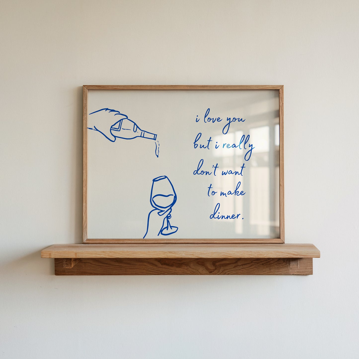 Print with hand-drawn blue line art of a bottle pouring wine into a glass beside the cursive quote "i love you but i really don't want to make dinner."