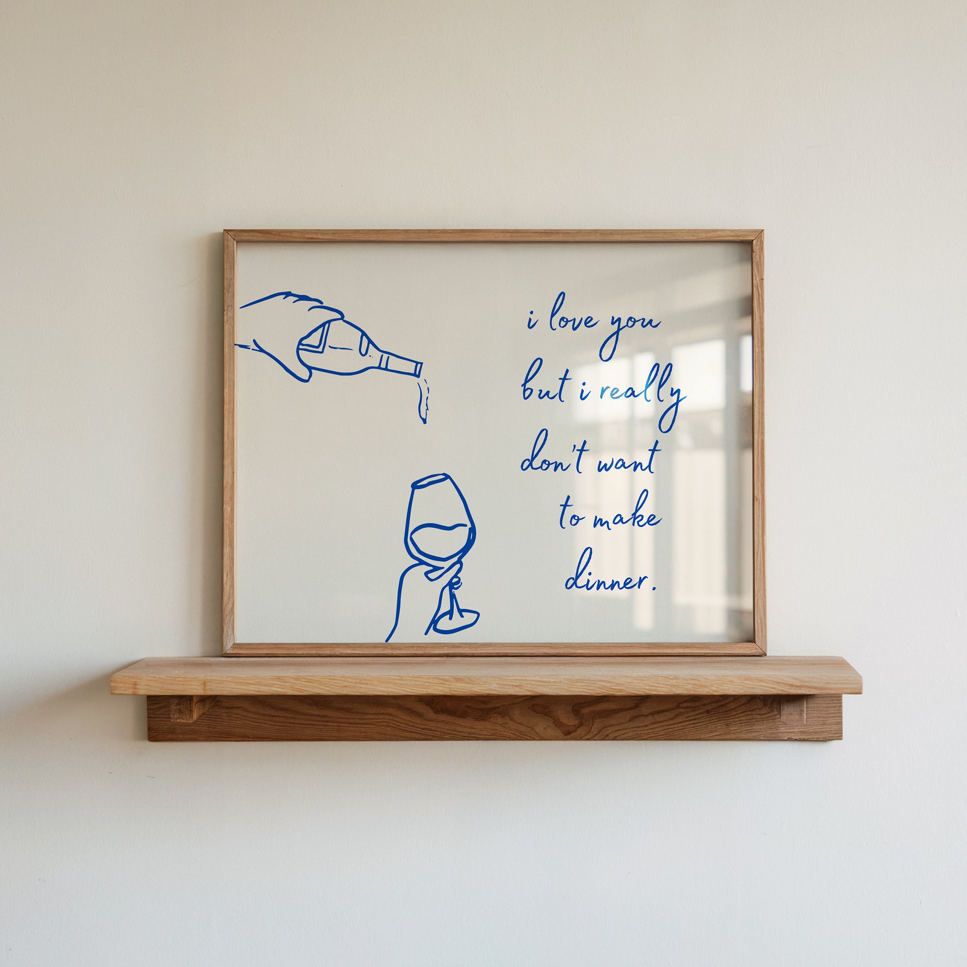 Print with hand-drawn blue line art of a bottle pouring wine into a glass beside the cursive quote "i love you but i really don't want to make dinner."