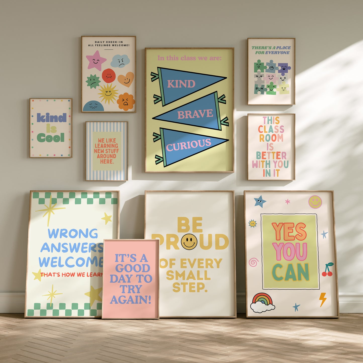 Set of 10 pastel classroom prints in a retro style, including blue pennant flags reading kind, brave, curious, a daily feelings check-in chart with smiling star, cloud, and sun characters, a puzzle piece print reading "There's a place for everyone," and colourful typography posters with quotes like "Wrong answers welcome," "Yes you can," and "It's a good day to try again."