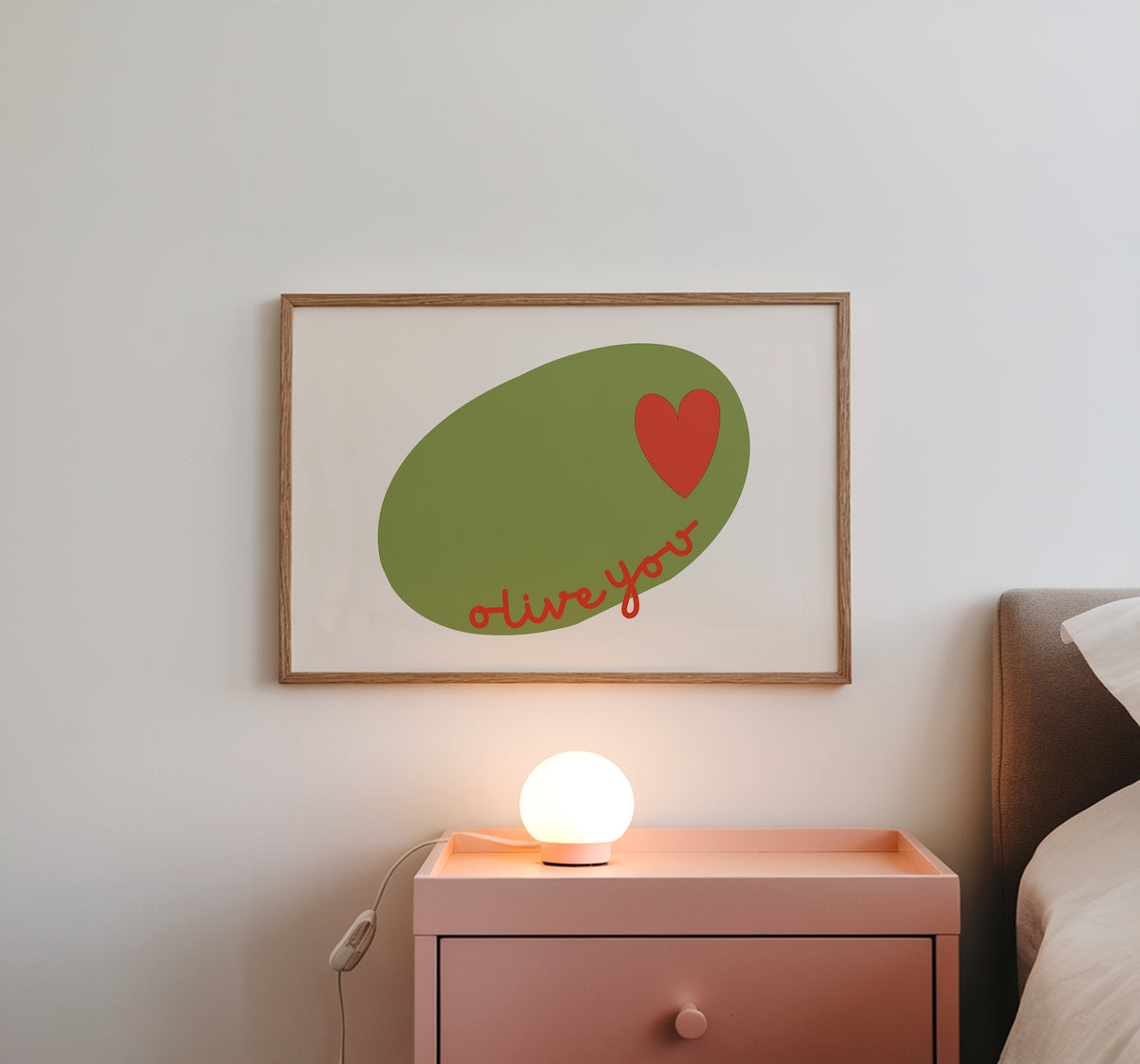 Horizontal print of a large green olive illustration with a small red heart and the words "olive you" in red cursive script, on a cream background.