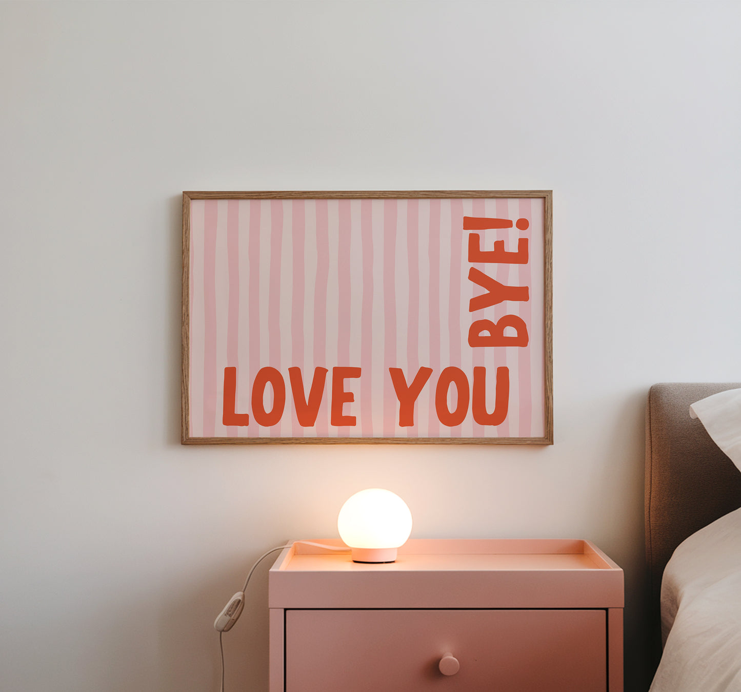 Horizontal wall print with soft pink wavy vertical stripes and bold red rounded typography reading LOVE YOU BYE! in the bottom corner