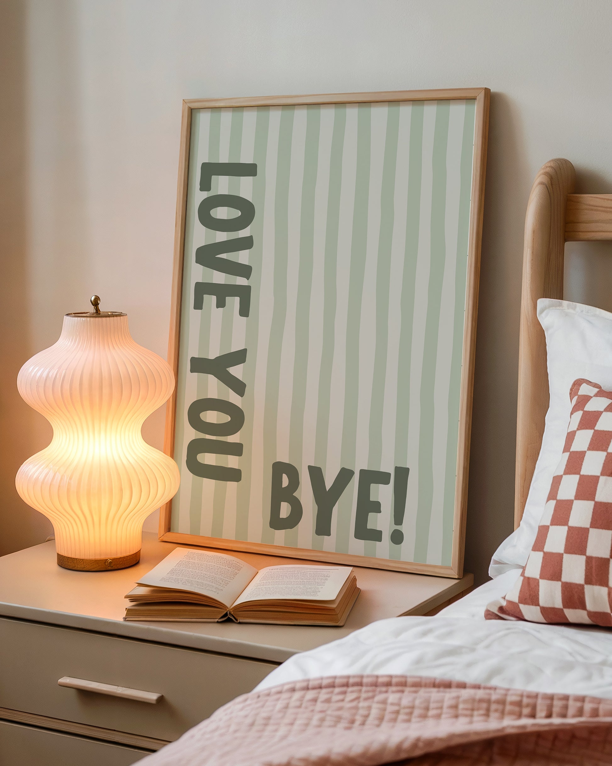 Vertical wall print with soft sage green wavy vertical stripes and bold dark green chunky typography reading LOVE YOU vertically on the left and BYE! horizontally at the bottom right