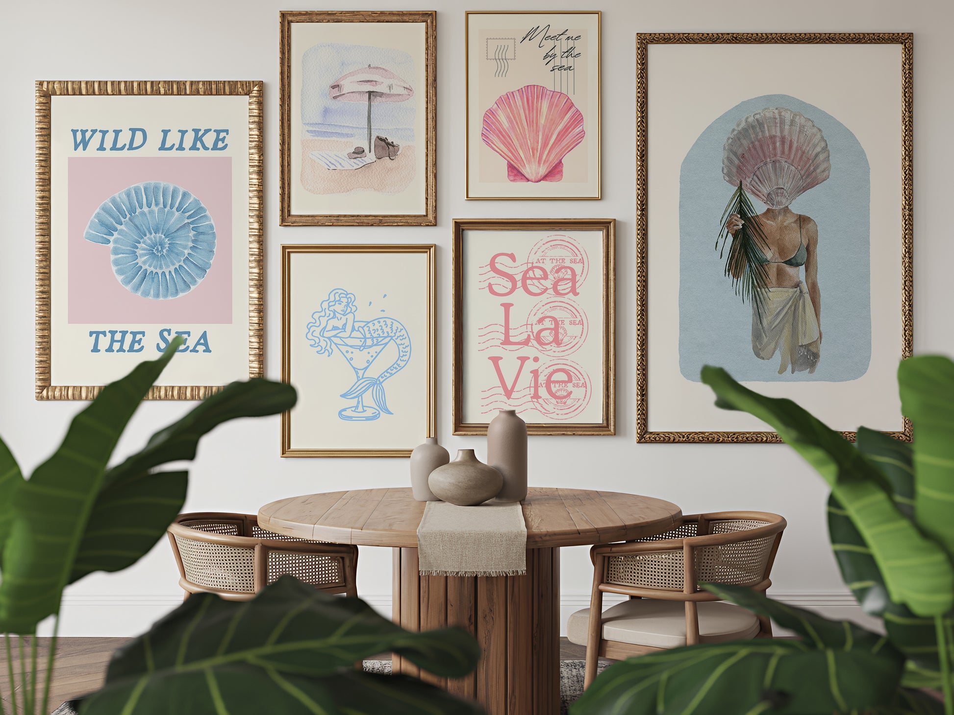 Set of 10 coastal watercolor prints in pink and blue: "Wild Like the Sea" beside a spiral shell illustration, "Stay Wild Ocean Child" in bold blue lettering, "Sea La Vie" in pink stamped typography, a mermaid lounging in a martini glass, pink starfish and seashell illustrations, a woman in a shell headdress, a beach umbrella watercolor, and "Meet me by the sea" in postcard-style script.