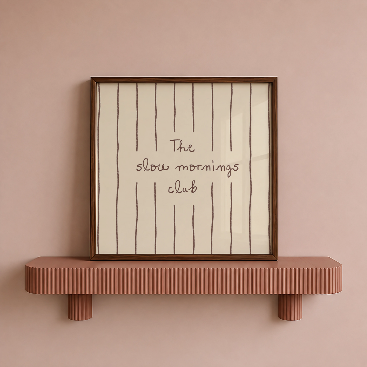 Minimalist print with "The slow mornings club" script text and vertical line pattern on cream background