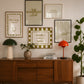 Set of five olive and cream prints including a checkered 'Actually it is all fun & games' print, a horseshoe 'How lucky are we' print, 'The Homebody Club', a striped 'good old days' print, and bubble-letter 'Home sweet'
