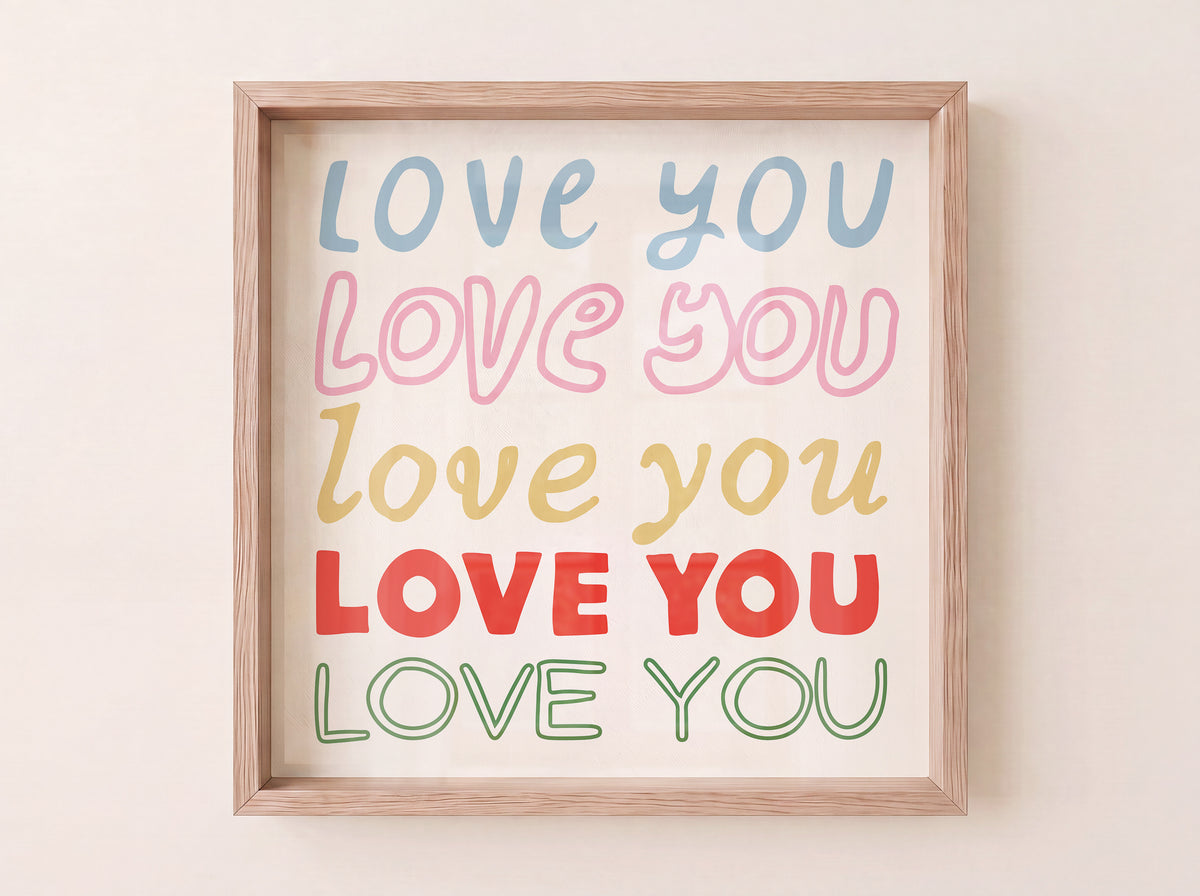 Square print with the words "Love You" repeated five times in different colors, fonts, and styles — blue, pink, gold, red, and green — stacked on a cream background.