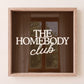 Dark brown print with "The Homebody Club" in bold cream serif and script typography