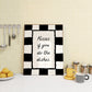 Black and white checkered print with a scalloped border and the handwritten quote "Kisses if you do the dishes" in black script