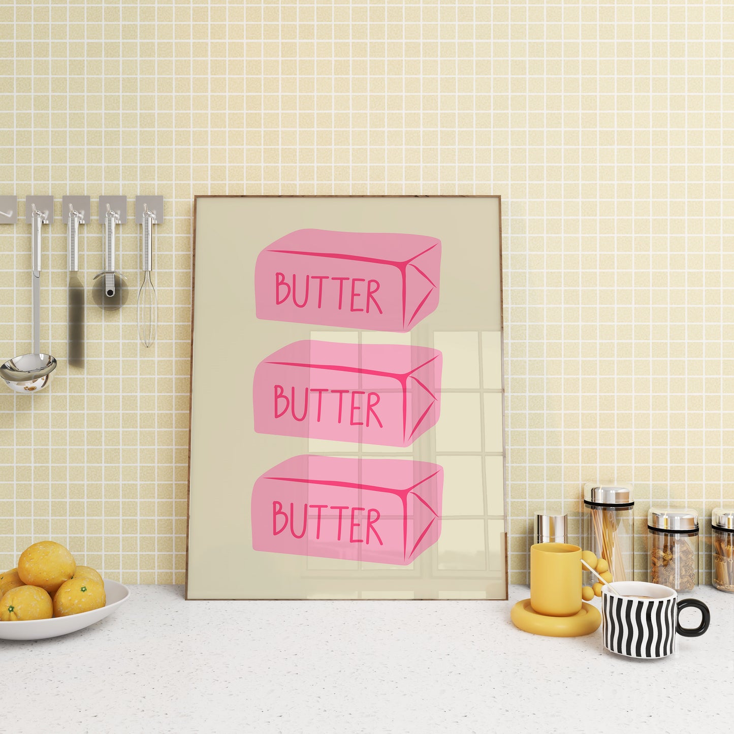 Vertical sage green wall print featuring three stacked illustrated pink butter blocks each labelled BUTTER in bold pink handwritten font