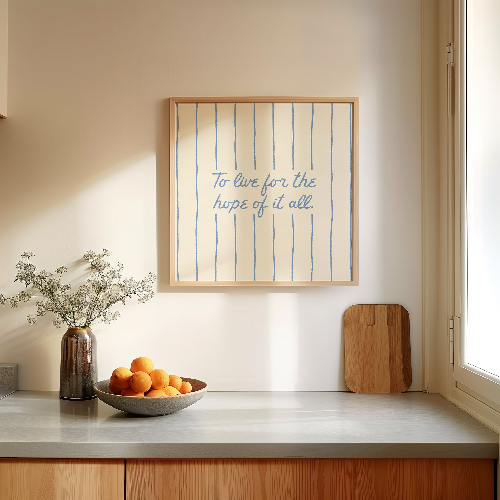 Cream print with thin vertical blue stripes and a hand-lettered quote in blue cursive script