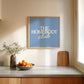 Square digital print with a dusty blue background featuring "THE HOMEBODY" in bold cream serif type stacked above "club" in cream cursive script, centered typography layout.