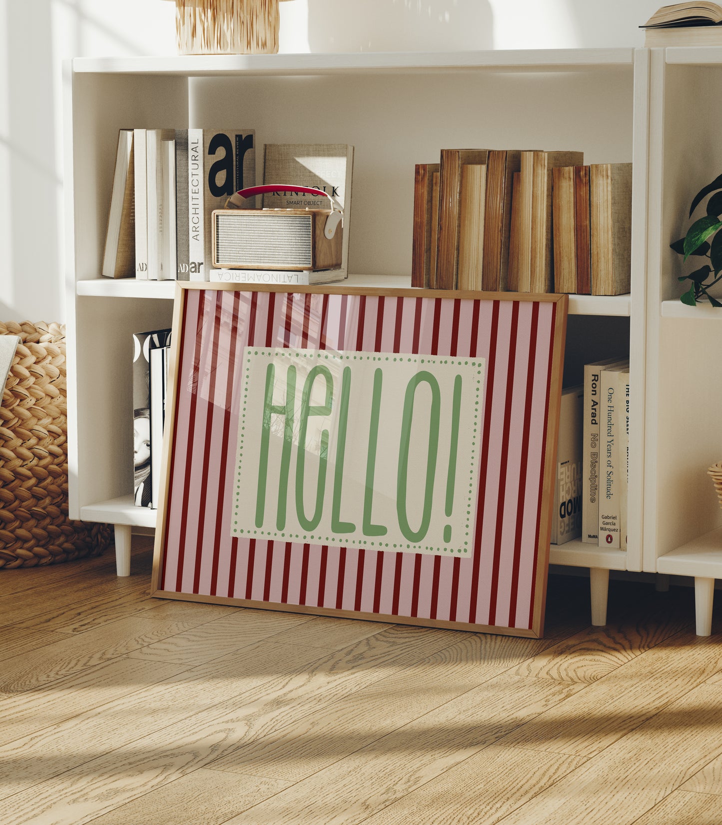 Horizontal wall print with bold dark red vertical stripes and a green dotted border text box reading HELLO! in chunky rounded green font