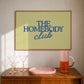 Rectangular landscape digital print with an olive-green background featuring "THE HOMEBODY" in bold blue serif type stacked above "club" in blue cursive script, centered typography layout.