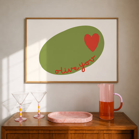 Horizontal print of a large green olive illustration with a small red heart and the words "olive you" in red cursive script, on a cream background.