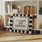 Horizontal wall print with bold black and cream vertical stripes forming a border around a cream text box with distressed black serif typography reading THANKS FOR LEAVING
