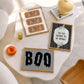 Set of 3 vintage-style Halloween prints: three "Trick or Treat, Admit One" ticket stubs, the word "BOO" in dripping black lettering, and "'Tis the season to be spooky" framed by skeleton hands on black and cream stripes.