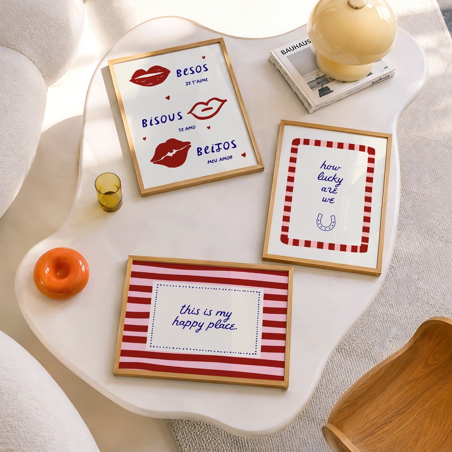 Set of three prints featuring "How lucky are we" with a horseshoe, "This is my happy place" in red stripes, and "Besos, Bisous, Beijos" with illustrated lips
