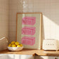 Vertical sage green wall print featuring three stacked illustrated pink butter blocks each labelled BUTTER in bold pink handwritten font