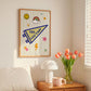 Woman hanging Yes You Can pennant art print on bedroom wall — whimsical varsity motivational dorm room wall decor