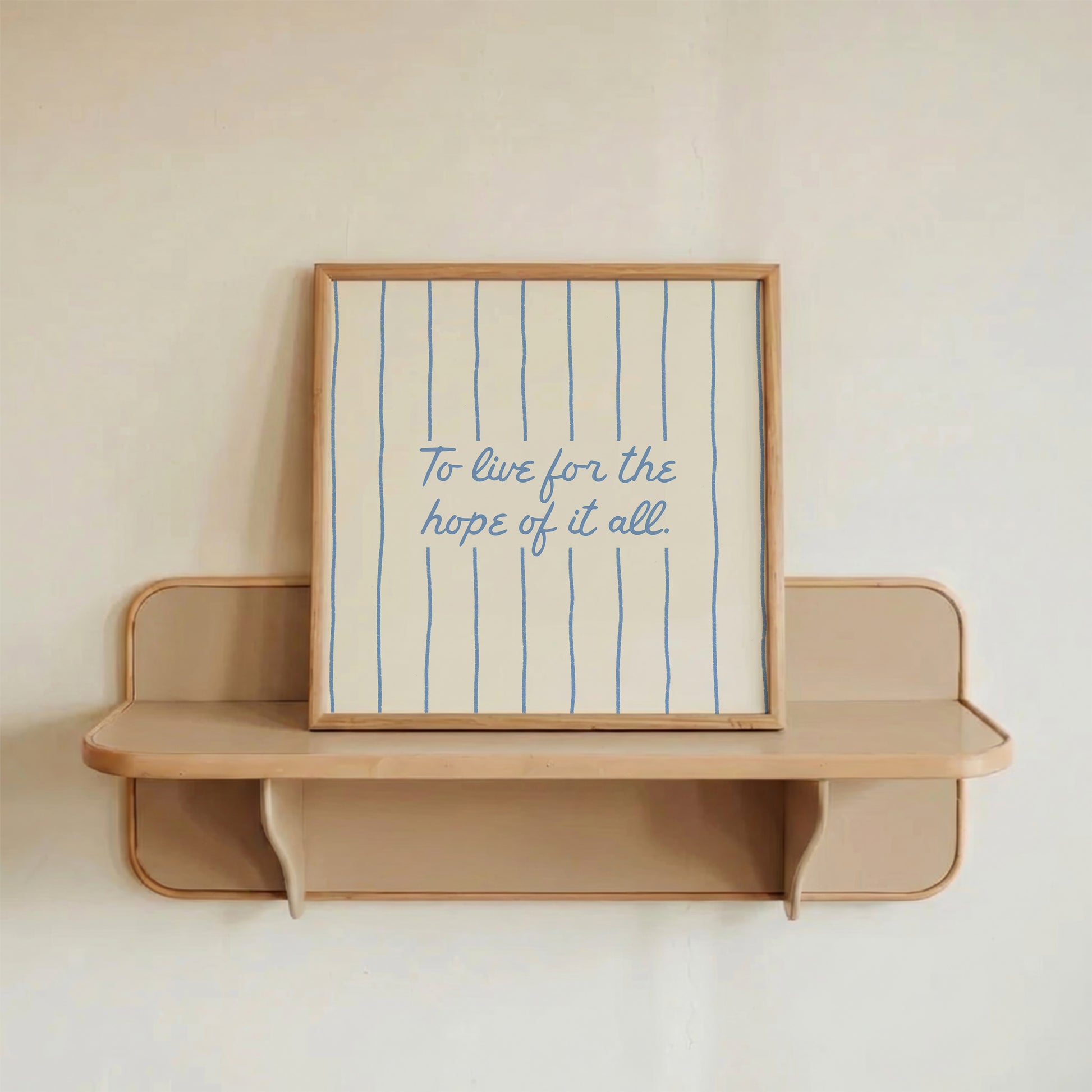 Cream print with thin vertical blue stripes and a hand-lettered quote in blue cursive script