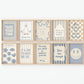 Set of 10 calm corner prints in tan and blue: "Take Your Time," "I am enough" on a smiley face, "Breathe" beside a meditating duck illustration, a "Daily Check-in, All Feelings Welcome!" chart with cartoon stars and clouds, "Slow Down, You're Doing Fine!", "You are enough," "Be Kind To Your Mind" on a checkered background, "This is a Safe Space" on a house shape, "The way you speak to yourself matters" beside a heart illustration, and "It's OK to Not Be OK."