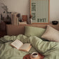 Vertical wall print with soft sage green wavy vertical stripes and bold dark green chunky typography reading LOVE YOU vertically on the left and BYE! horizontally at the bottom right