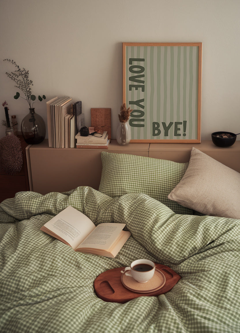 Vertical wall print with soft sage green wavy vertical stripes and bold dark green chunky typography reading LOVE YOU vertically on the left and BYE! horizontally at the bottom right
