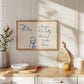 Print with hand-drawn blue line art of a bottle pouring wine into a glass beside the cursive quote "i love you but i really don't want to make dinner."