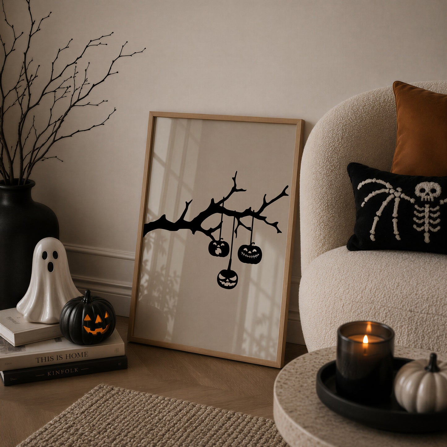 Set of 3 black and white Halloween prints: dripping "Trick or Treat" typography, "'Tis the season to be spooky" framed by skeleton hands, and a black silhouette branch with hanging jack-o'-lanterns.