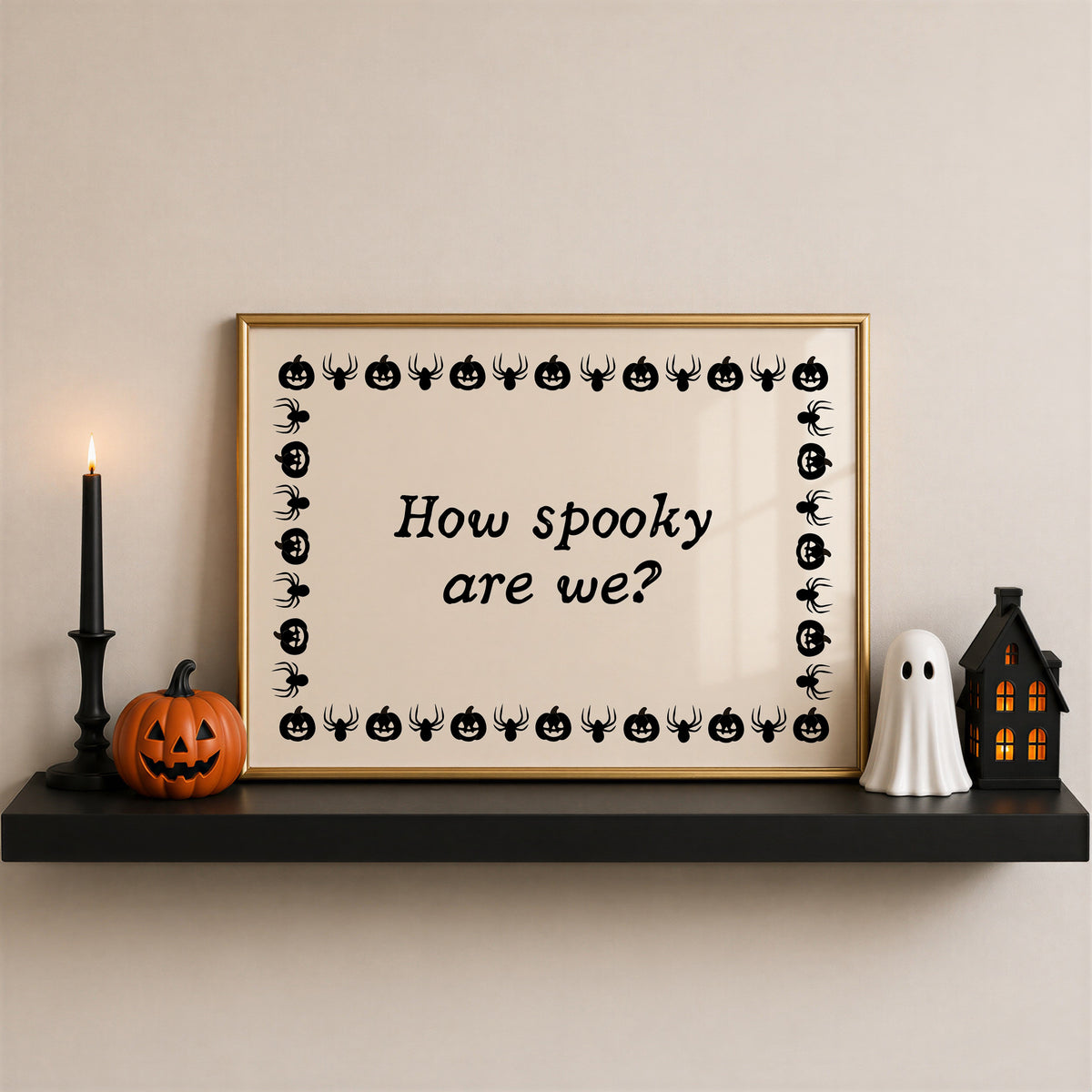 Landscape digital print with a cream background bordered by alternating black pumpkin and spider illustrations, framing the hand-lettered phrase "How spooky are we?" in black script.