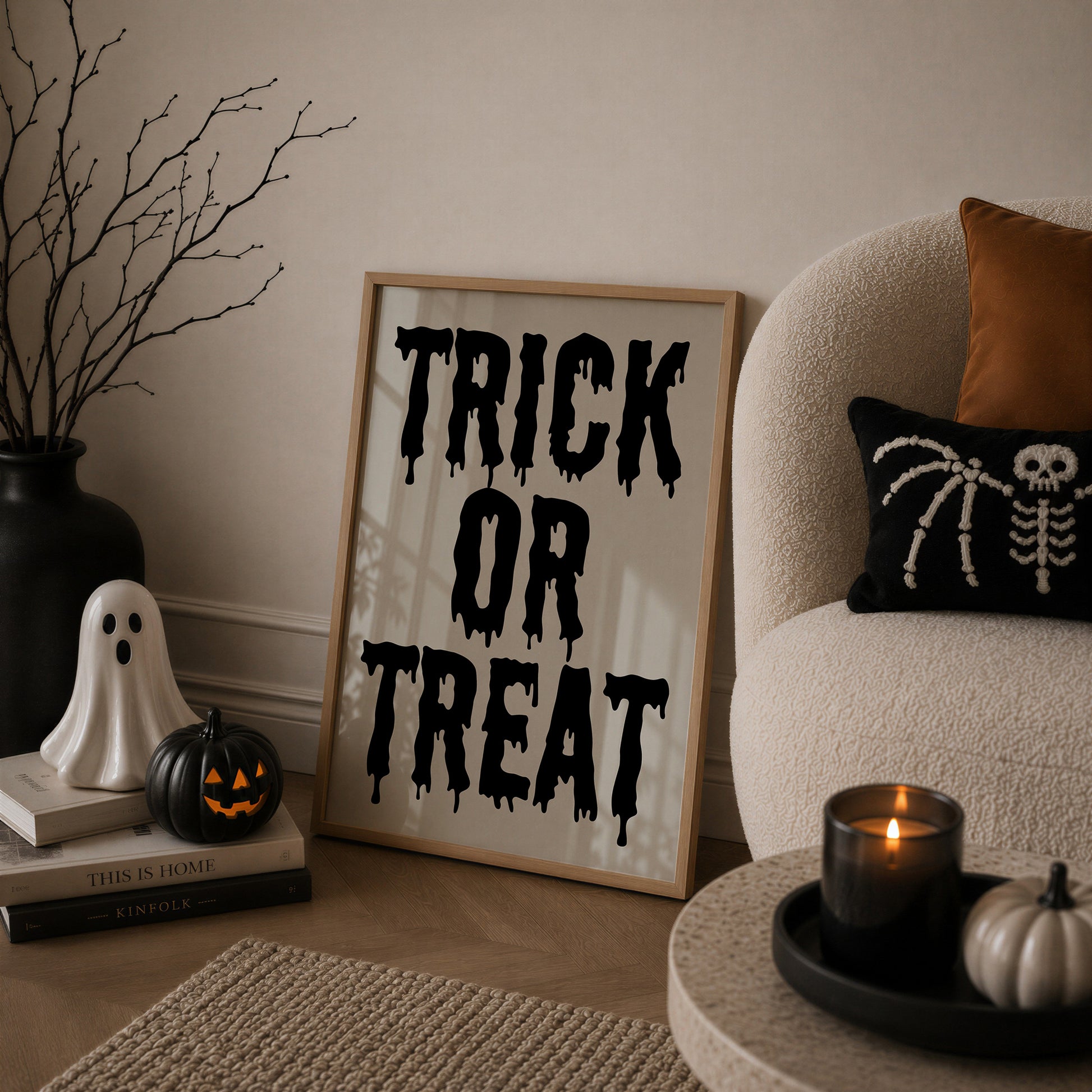 Set of 3 black and white Halloween prints: dripping "Trick or Treat" typography, "'Tis the season to be spooky" framed by skeleton hands, and a black silhouette branch with hanging jack-o'-lanterns.