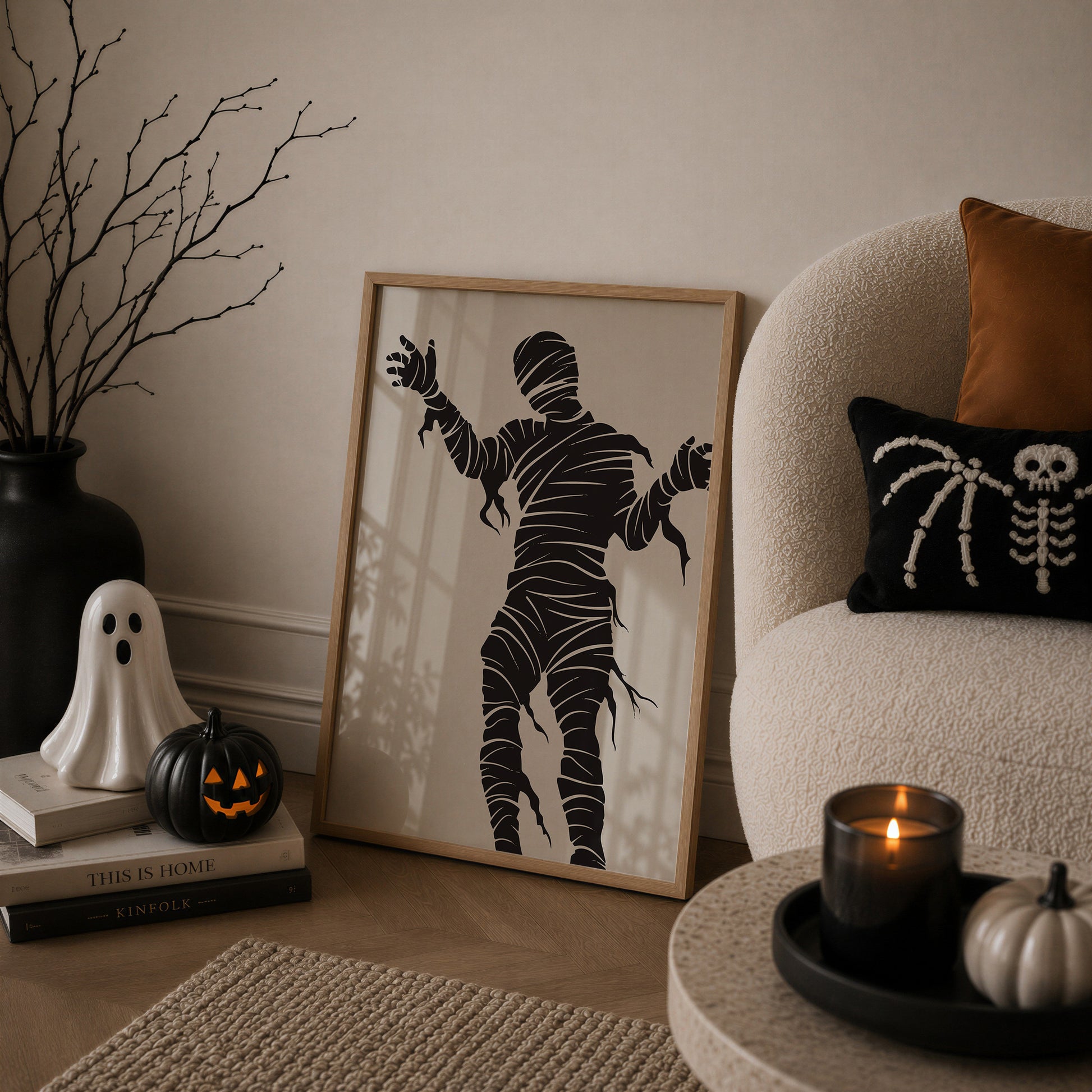 Set of 3 Halloween prints: "Trick or Treat" in dripping black lettering, "Spooky Season" on orange striped fabric with a spider and skeleton, and a bold black silhouette of a mummy.