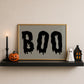 Set of 3 vintage-style Halloween prints: three "Trick or Treat, Admit One" ticket stubs, the word "BOO" in dripping black lettering, and "'Tis the season to be spooky" framed by skeleton hands on black and cream stripes.