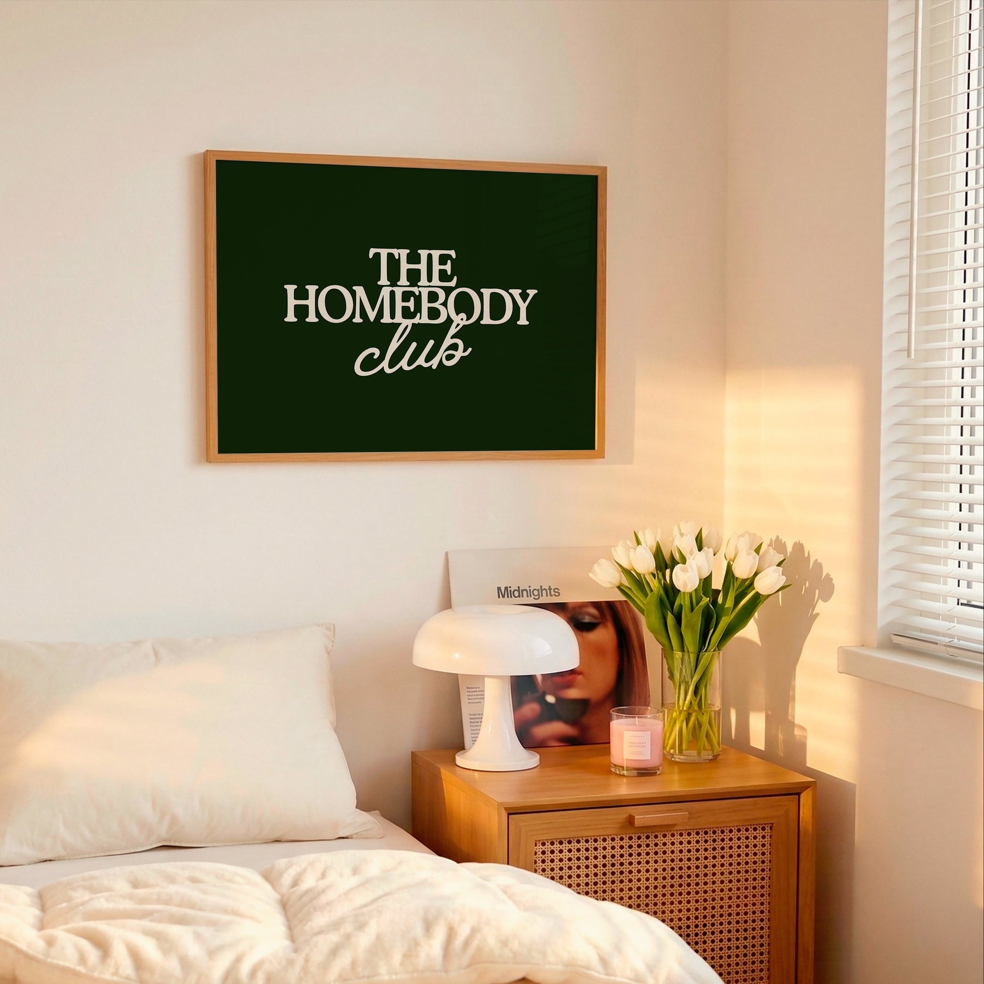 Dark green print with "The Homebody Club" in cream serif and script typography