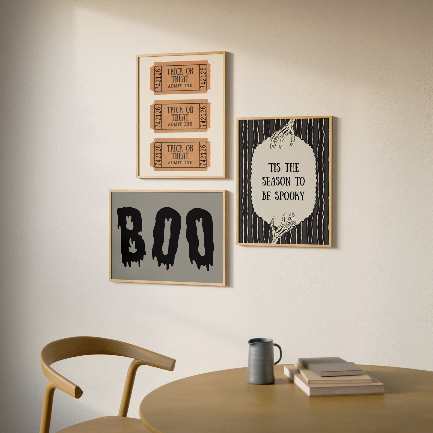 Set of 3 vintage-style Halloween prints: three "Trick or Treat, Admit One" ticket stubs, the word "BOO" in dripping black lettering, and "'Tis the season to be spooky" framed by skeleton hands on black and cream stripes.