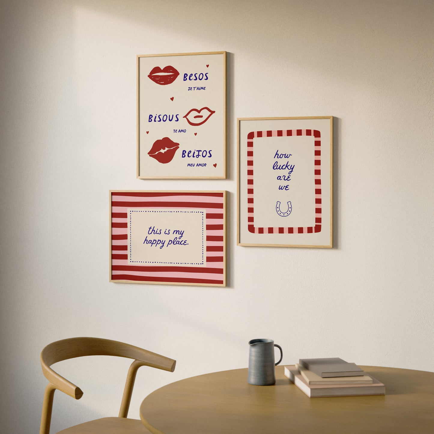 Set of three prints featuring "How lucky are we" with a horseshoe, "This is my happy place" in red stripes, and "Besos, Bisous, Beijos" with illustrated lips