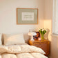 Horizontal wall print with soft sage green vertical stripes and a cream scalloped border text box reading spark joy or get out in matching sage green cursive font