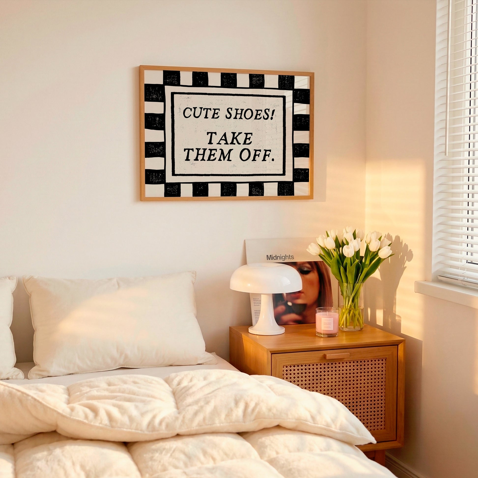 Horizontal print with a bold black and white checkered border framing the quote "CUTE SHOES! TAKE THEM OFF." in black vintage serif type on a cream background.