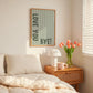 Vertical wall print with soft sage green wavy vertical stripes and bold dark green chunky typography reading LOVE YOU vertically on the left and BYE! horizontally at the bottom right