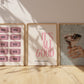 Set of three prints featuring bold pink 'It's All Good' typography, a vintage newspaper cocktail print, and a pink 'Happy Hour' ticket grid