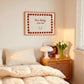 White print with a red and pink striped border featuring the handwritten quote 'how lucky are we' and a horseshoe illustration