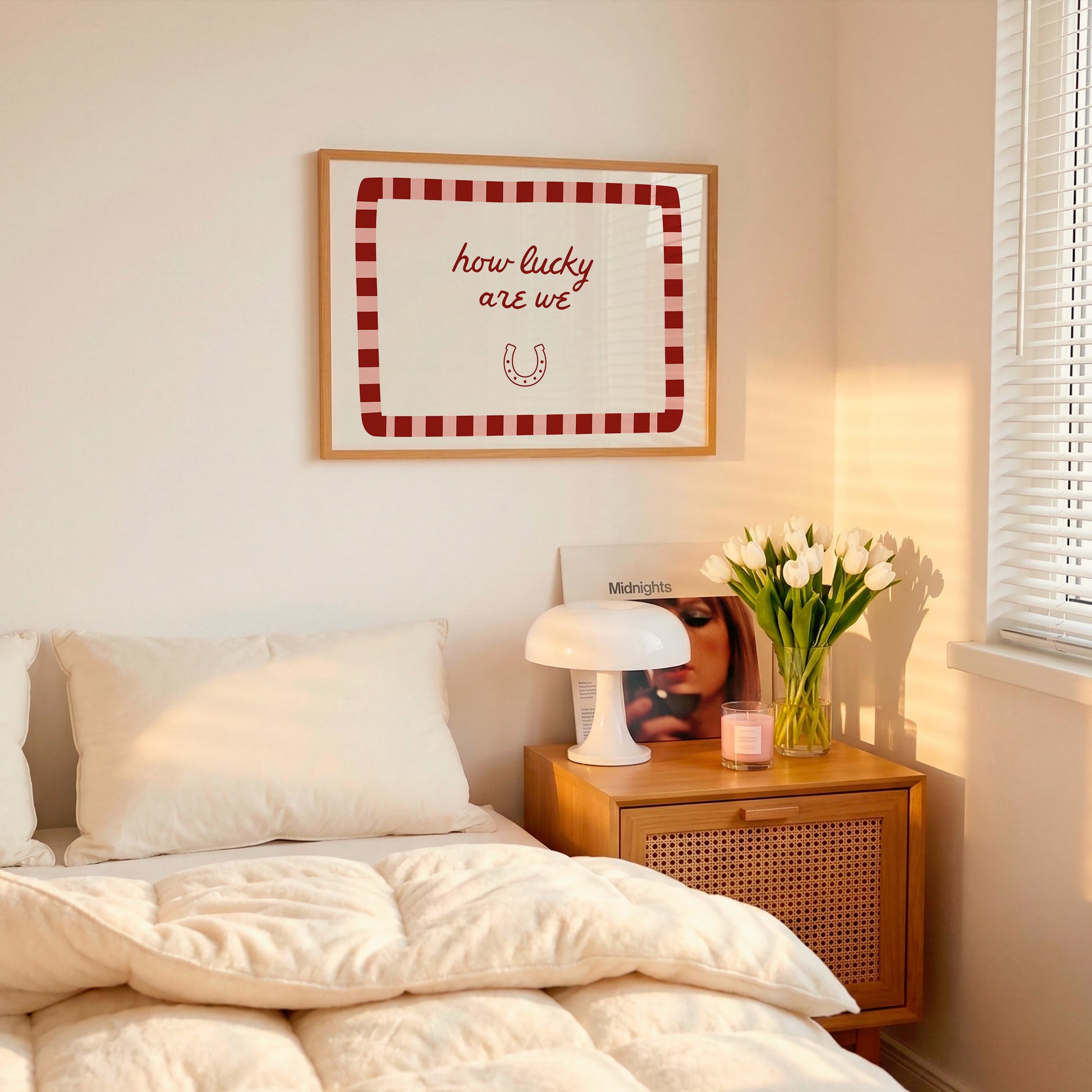 White print with a red and pink striped border featuring the handwritten quote 'how lucky are we' and a horseshoe illustration