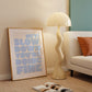 Square wall print on a warm cream background with bold periwinkle blue chunky mixed typography reading Hey! Slow down You're Fine You got this