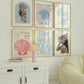Set of 10 coastal watercolor prints in pink and blue: "Wild Like the Sea" beside a spiral shell illustration, "Stay Wild Ocean Child" in bold blue lettering, "Sea La Vie" in pink stamped typography, a mermaid lounging in a martini glass, pink starfish and seashell illustrations, a woman in a shell headdress, a beach umbrella watercolor, and "Meet me by the sea" in postcard-style script.