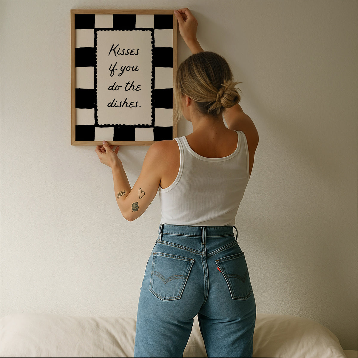 Black and white checkered print with a scalloped border and the handwritten quote "Kisses if you do the dishes" in black script