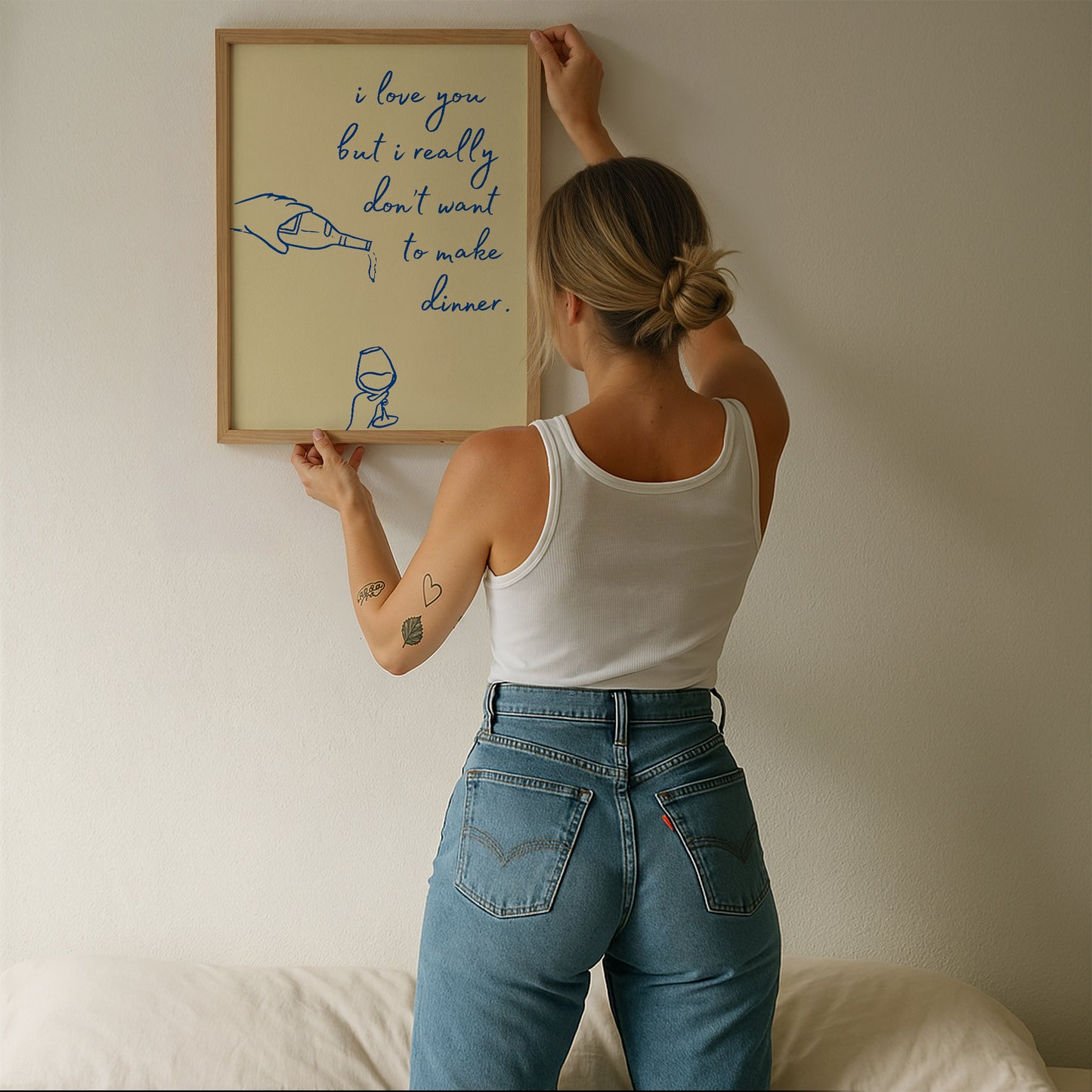 Vertical cream wall print with navy blue cursive script reading i love you but i really don't want to make dinner with hand-drawn line art of a pouring wine bottle and a wine glass
