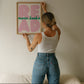 Vertical print with the word "READ" in oversized pink bubble letters and "more books" in green cursive script layered across it, on a white background.