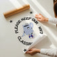 Vertical cream wall print with bold arched black typography reading Please Keep Our Classroom Clean surrounding a retro cartoon trash can character wearing sneakers with asterisk corner details