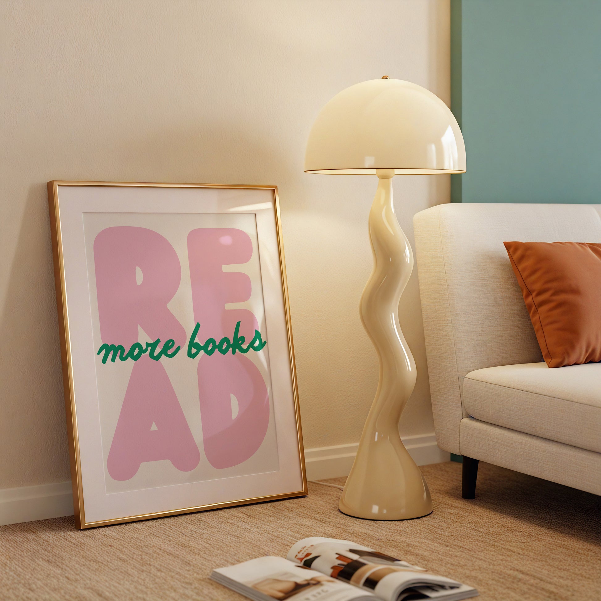 Vertical print with the word "READ" in oversized pink bubble letters and "more books" in green cursive script layered across it, on a white background.